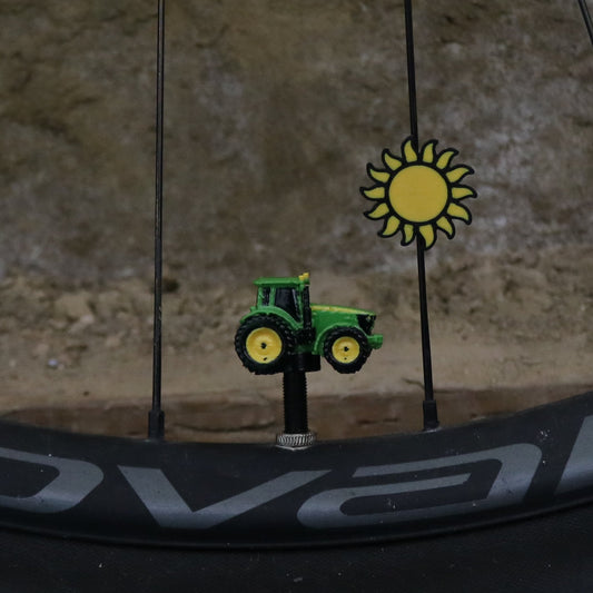 Full bicycle wheel showing the Sun Spoke Clip; valve cap not included