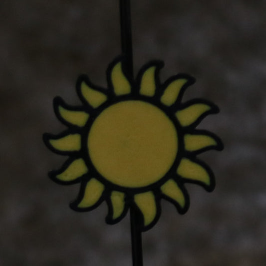 Sun Spoke Clip alone attached to a bicycle spoke, front view